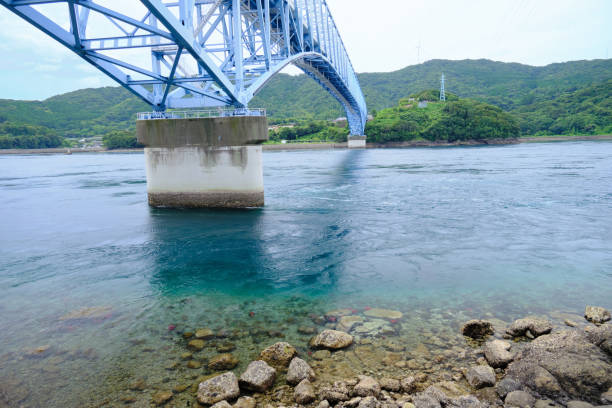 istock Whirlpool sea and Kuronosetoo Bridge 1348313330