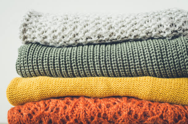 istock Pile of knitted woolen sweaters 1348320677