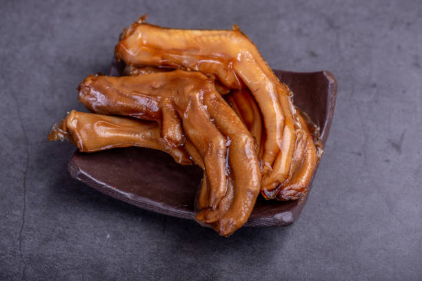 istock The stewed duck claws in the container are in a dark background 1348320923