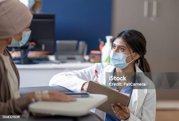 Doctor Talking With A Cancer Patient Stock Photo - Download Image Now - Cancer - Illness, Medical Research, Patient