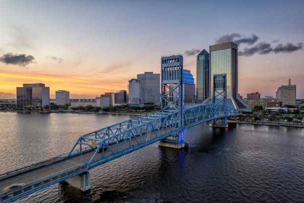 Jacksonville at Dusk - FL Aerial view of Jacksonville cityscape at dusk golden hour photos stock pictures, royalty-free photos & images