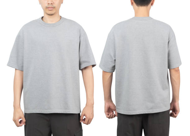 istock Young man in grey oversize t-shirt mockup front and back used as design template, isolated on white background with clipping path 1348327770