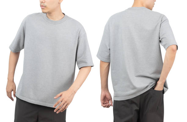 istock Young man in grey oversize t-shirt mockup front and back used as design template, isolated on white background with clipping path 1348327778