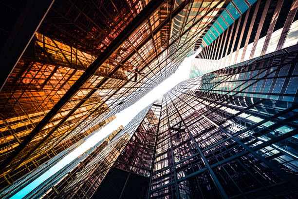 istock Looking up a reflections on glass covered corporate building 1348328432