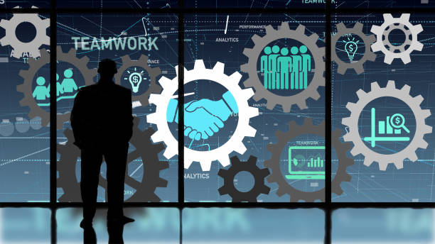 Business teamwork and success concept Business person looking at interlocking gears connecting teamworks icons. corporate hierarchy stock pictures, royalty-free photos & images