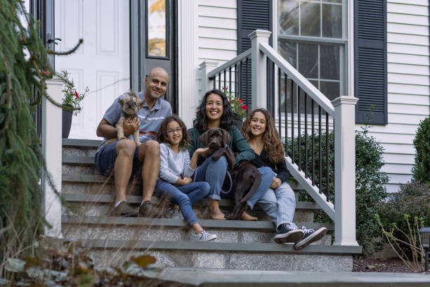 istock Family in front of their house 1348334703