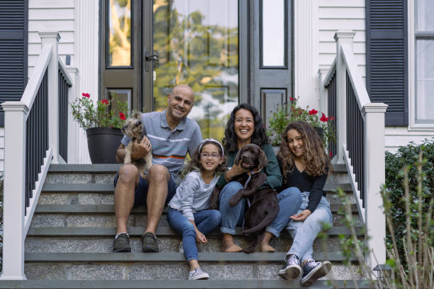 Family in front of their house Family in front of their house in front of stock pictures, royalty-free photos & images