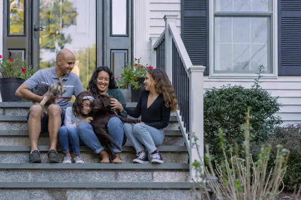 Photo of Family in front of their house