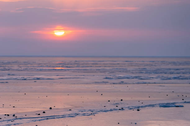 istock Dramatic sunset over the icy surface of the sea 1348347698