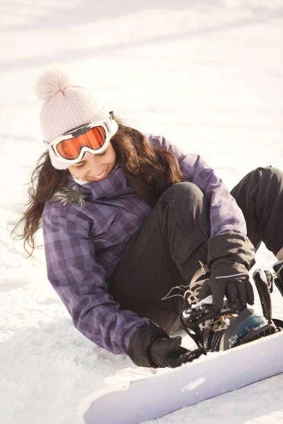 istock Woman wearing a snowboard 1348349278