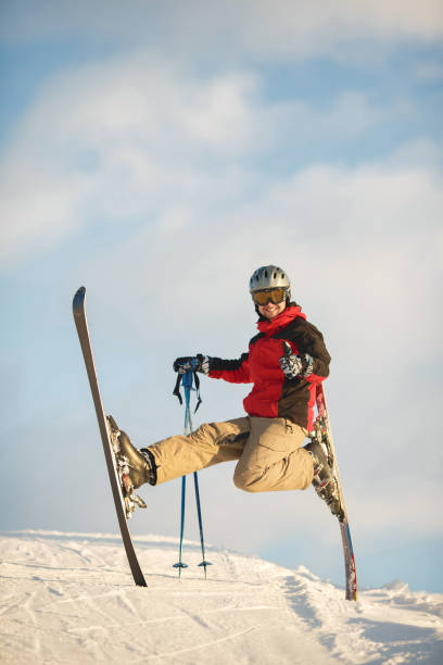 istock Guy deftly skis in sunny weather and has fun 1348349380