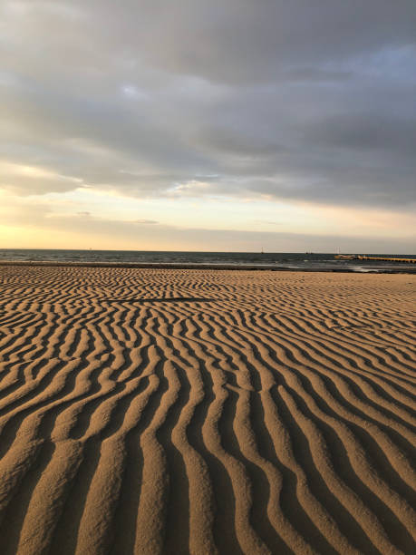 istock Natural background: Rippled sand in early morning light beach 1348351721