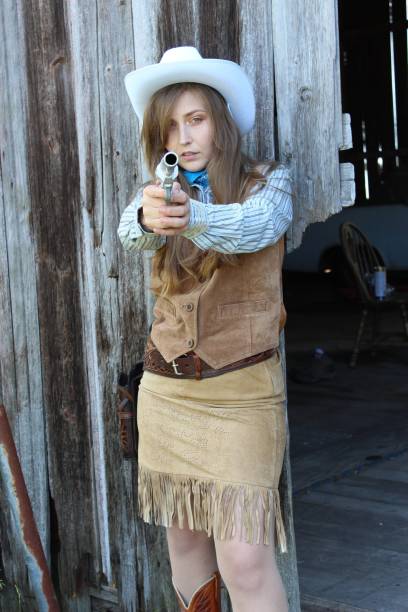 istock American Cowgirl in a barn 1348358375