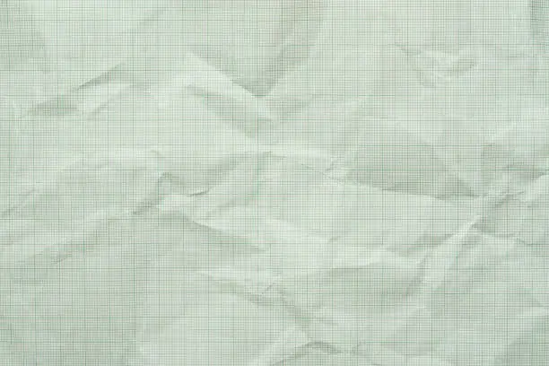 Photo of Old crumpled or wrinkled graph paper texture