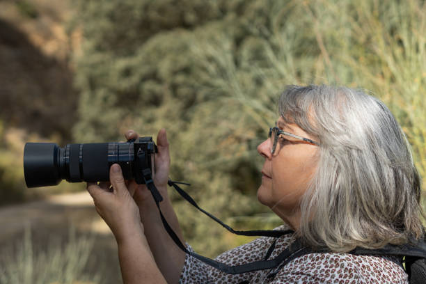 istock woman taking pictures 1348359697