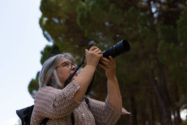 istock woman taking pictures 1348359703