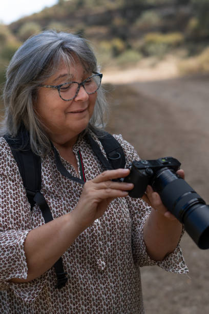 istock woman taking pictures 1348359705