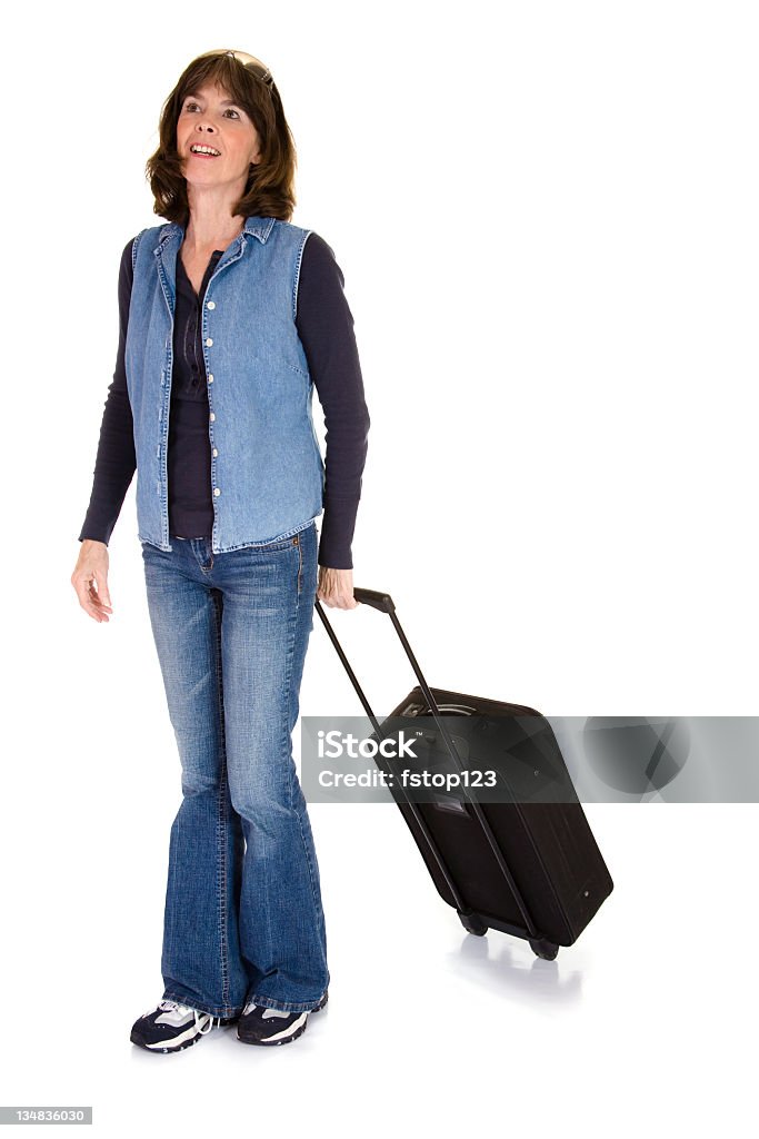 Donna matura camminando con bagagli - Foto stock royalty-free di Donne