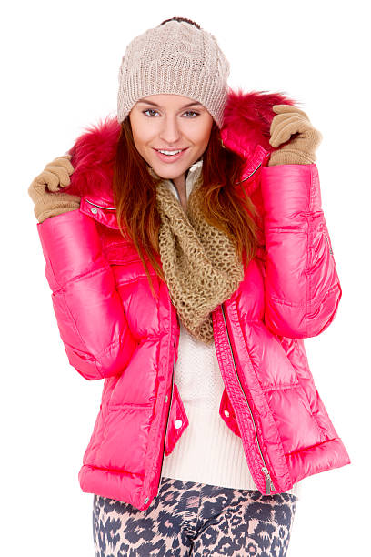 istock Young woman wearing winter jacket scarf and cap 134836227