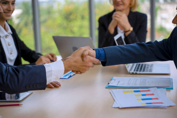 istock White collar workers engagement and meeting. 1348362546