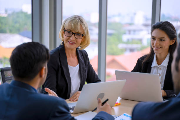 istock White collar workers are working and meeting. 1348363905