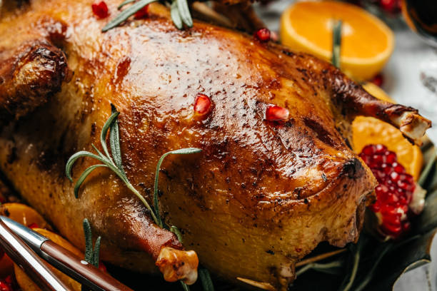 istock Tasty roasted duck with oranges for Thanksgiving or Christmas dinner 1348364914