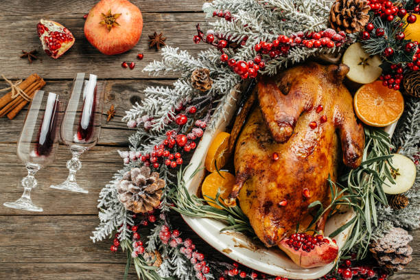 istock Christmas roast duck with oranges and wine served on a festive table. top view 1348364949