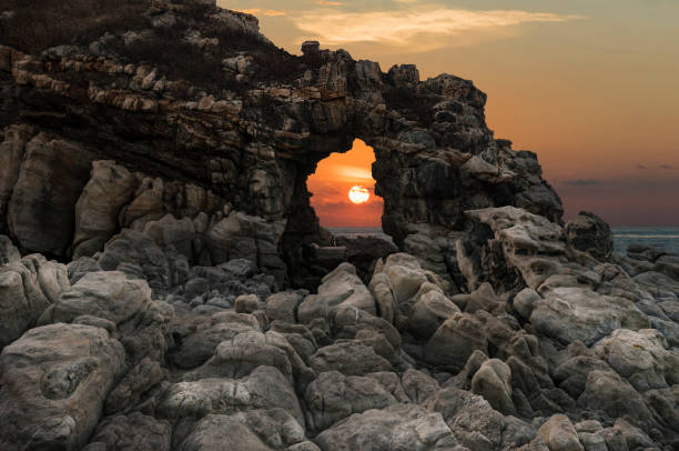 Puerto Escondido, rock on the sea ,sunset