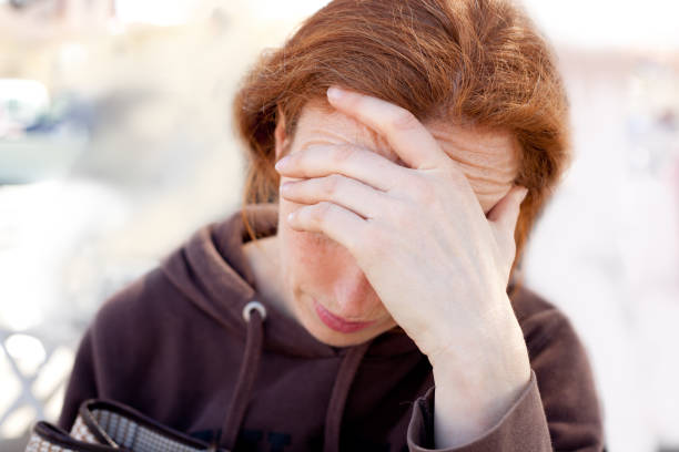 istock sad woman with hand in head 1348369695