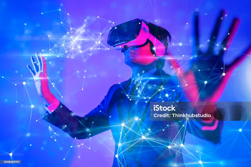 Metaverse digital cyber world technology, man with virtual reality VR goggle playing AR augmented reality game and entertainment, futuristic lifestyle Metaverse Stock Photo