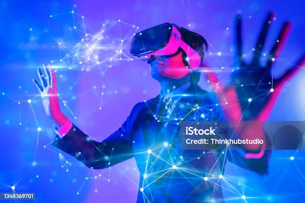 Metaverse Digital Cyber World Technology Man With Virtual Reality Vr Goggle Playing Ar Augmented Reality Game And Entertainment Futuristic Lifestyle Stock Photo - Download Image Now