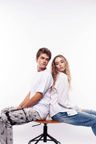 istock young couple posing on white background isolated, fighting, arguing, unhappy people concept 1348370971