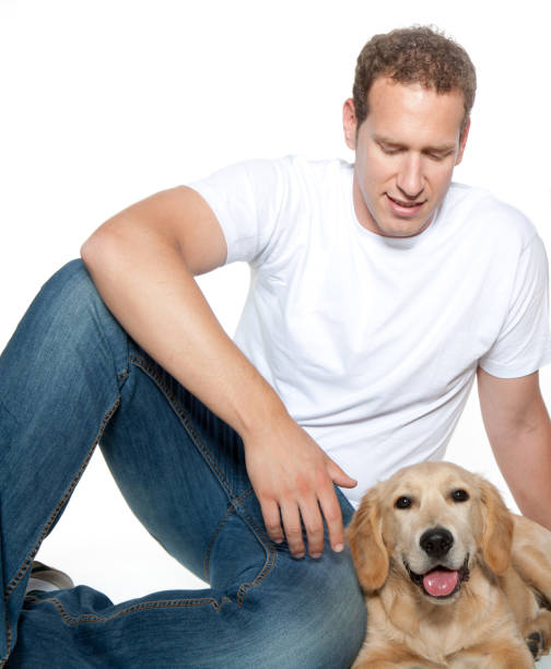 man with dog golden retriever puppy