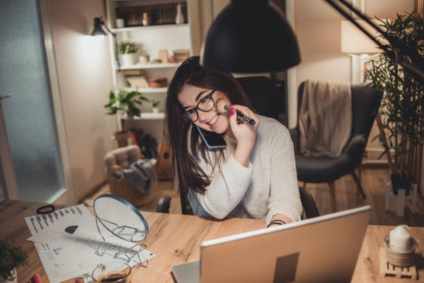 istock A young woman uses a laptop at night 1348377382