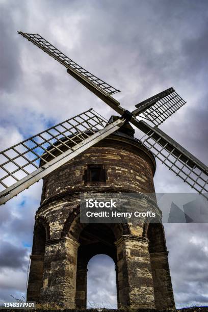 Chesterton Windmill Stands Tall With Moody Sky On Rainy Day Stock Photo - Download Image Now