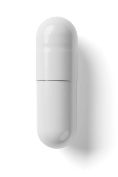 White capsule isolated on white background. 3d rendering. White two-piece hard starch capsule isolated on white background. 3d rendering illustration. isolated colour stock pictures, royalty-free photos & images