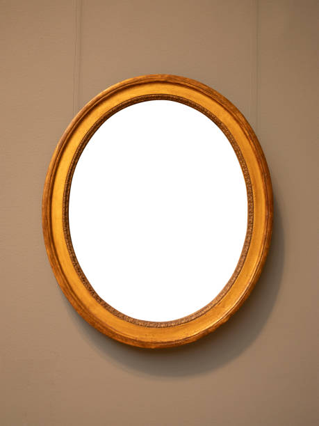 istock Vintage oval shape wooden frame hanging on wall with empty space 1348378002