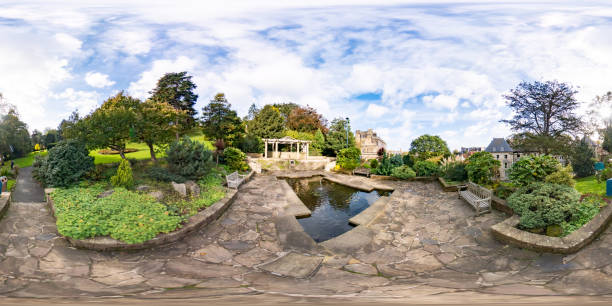Whitby, North Yorkshire – October 2021. Full spherical seamless panorama 360 degrees angle view of the Pool water feature located in Pannett Park, a public space, in the seaside town of Whitby . This is an equirectangular projection that can be used for virtual reality (VR) content and similar immersive uses.