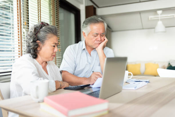 istock Asian Senior Couple having debt and financial problems 1348381433