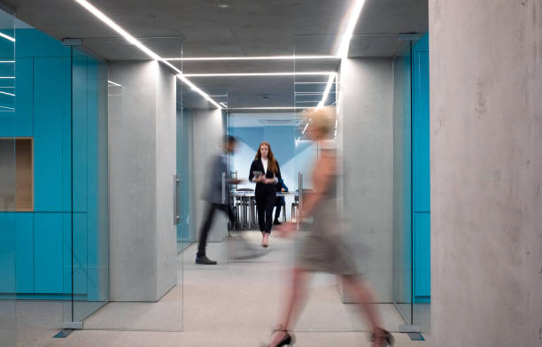 istock Business people walking in the corridor 1348383729