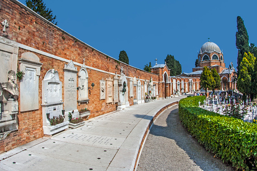 Venice, Italy - April 10, 2007: gravestones at cemetery island of San Michele in Venice, Italy. San Michele is since centuries the most important cemetery of Venice.