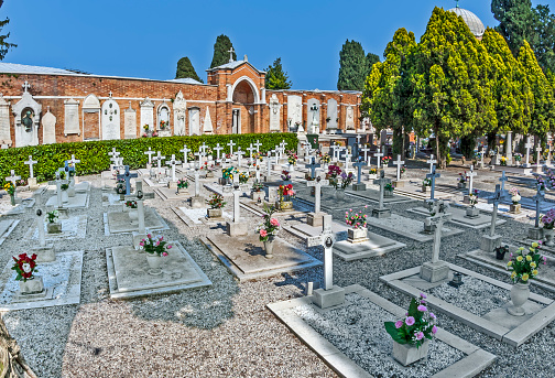 Venice, Italy - April 10, 2007:  gravestones at cemetery island of San Michele in Venice, Italy. San Michele is sice centuries the most important cemetery of Venice.