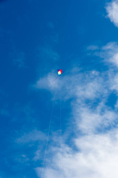 istock Colorful Kites flying over the sky 1348387418