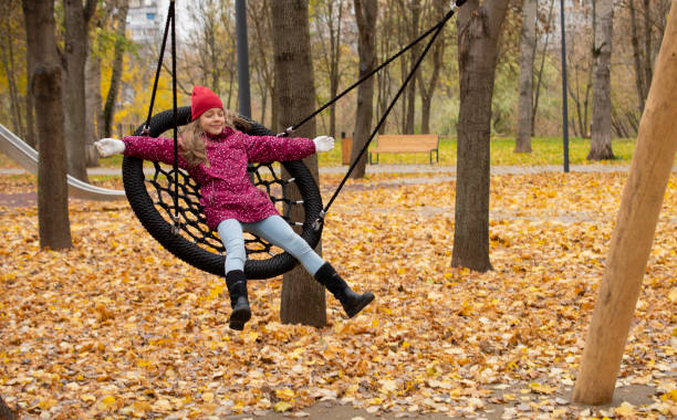 istock girl lay on swing 1348388267