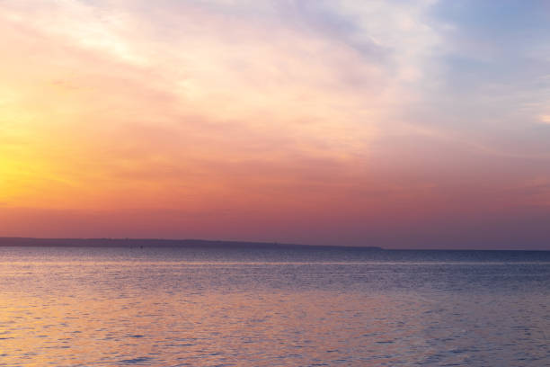 istock sunrise on the water 1348390238