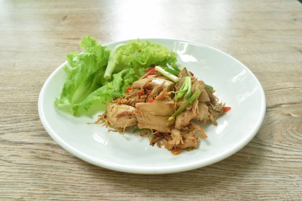 istock spicy fried roasted chicken meat with chili dressing slice spring onion with lettuce 1348390397