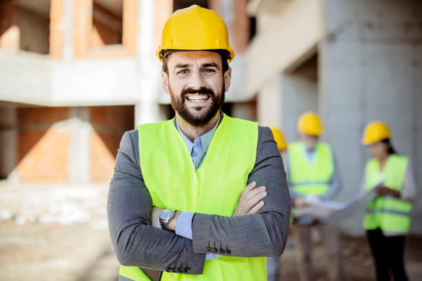 istock Portrait of an Architect at Building Site Looking at Camera 1348394173
