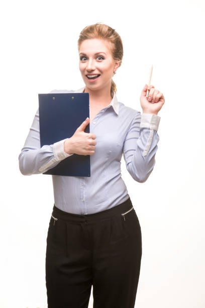 istock businessman girl on a white background makes notes on a tablet with sheets. young attractive blonde business lady in a blue blouse and a black office skirt. 1348396848