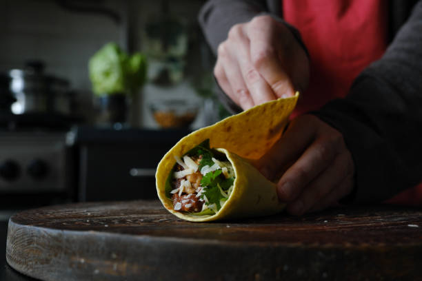 istock Wrapping stuff into homemade burrito 1348405837