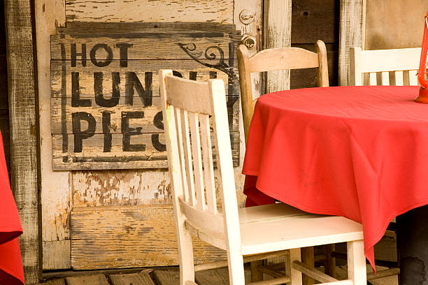 Restaurant in an old western town advertising hot lunch and pies. Antique, rustic cafe.  MORE LIKE THIS... in lightboxes below!